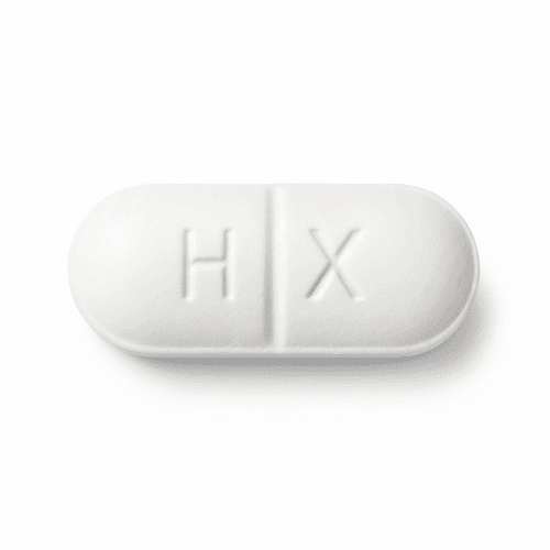 A crisp white Hiprex tablet, embossed with H X and scored for easy halving, for embedded or chronic UTI sufferers