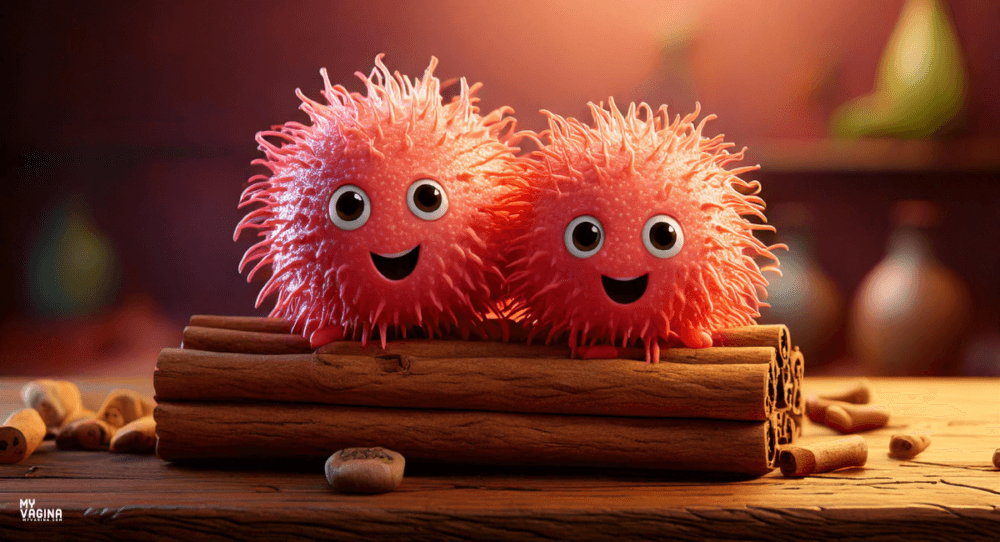 Two cute bacteria sit on some cinnamon sticks grinning.