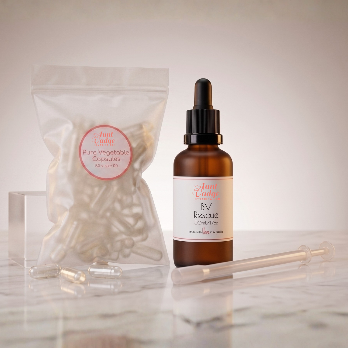 The BV Rescue kit, with a 50ml bottle of formula, the bag of 50 vegetable capsules and the capsule applicator lying in front on a bathroom counter.
