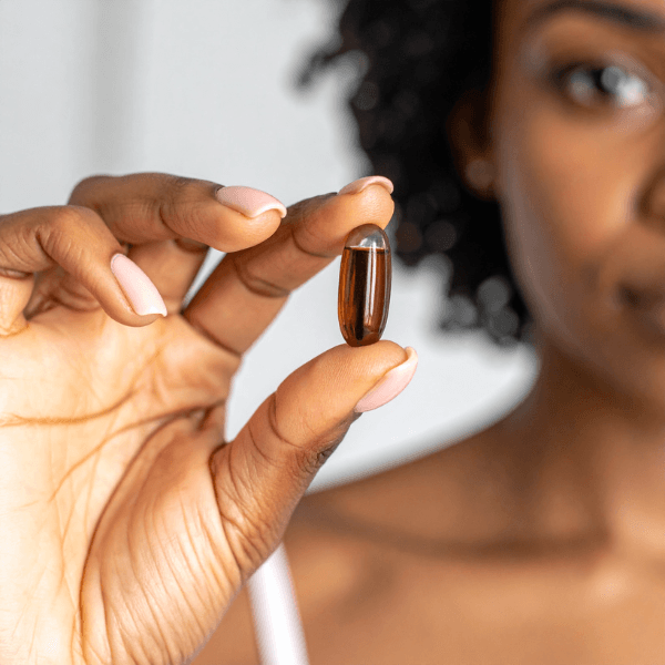 A woman holds a pessary for BV